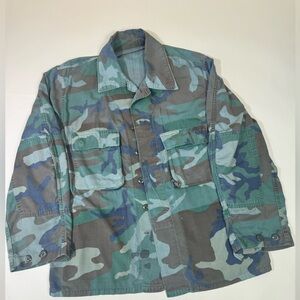 Worn Camouflage shirt jacket.